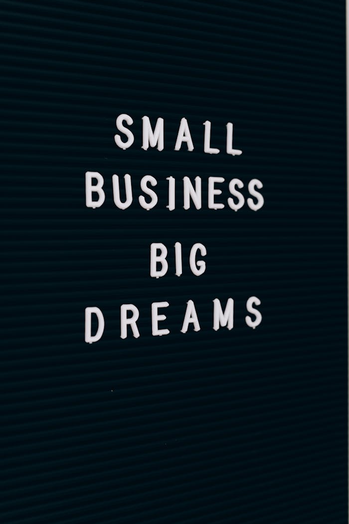 Close-up of a motivational quote about small business dreams on a letter board.
